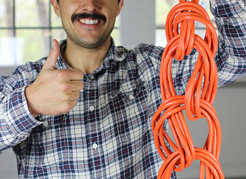 No More Tangled Extension Cords: How to Wrap Up Your Extension Cord Like a  Contractor
