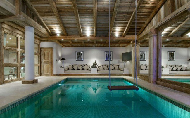 Indoor-pool-with-a-swing-inside-a-chalet-800-x-500--650x406